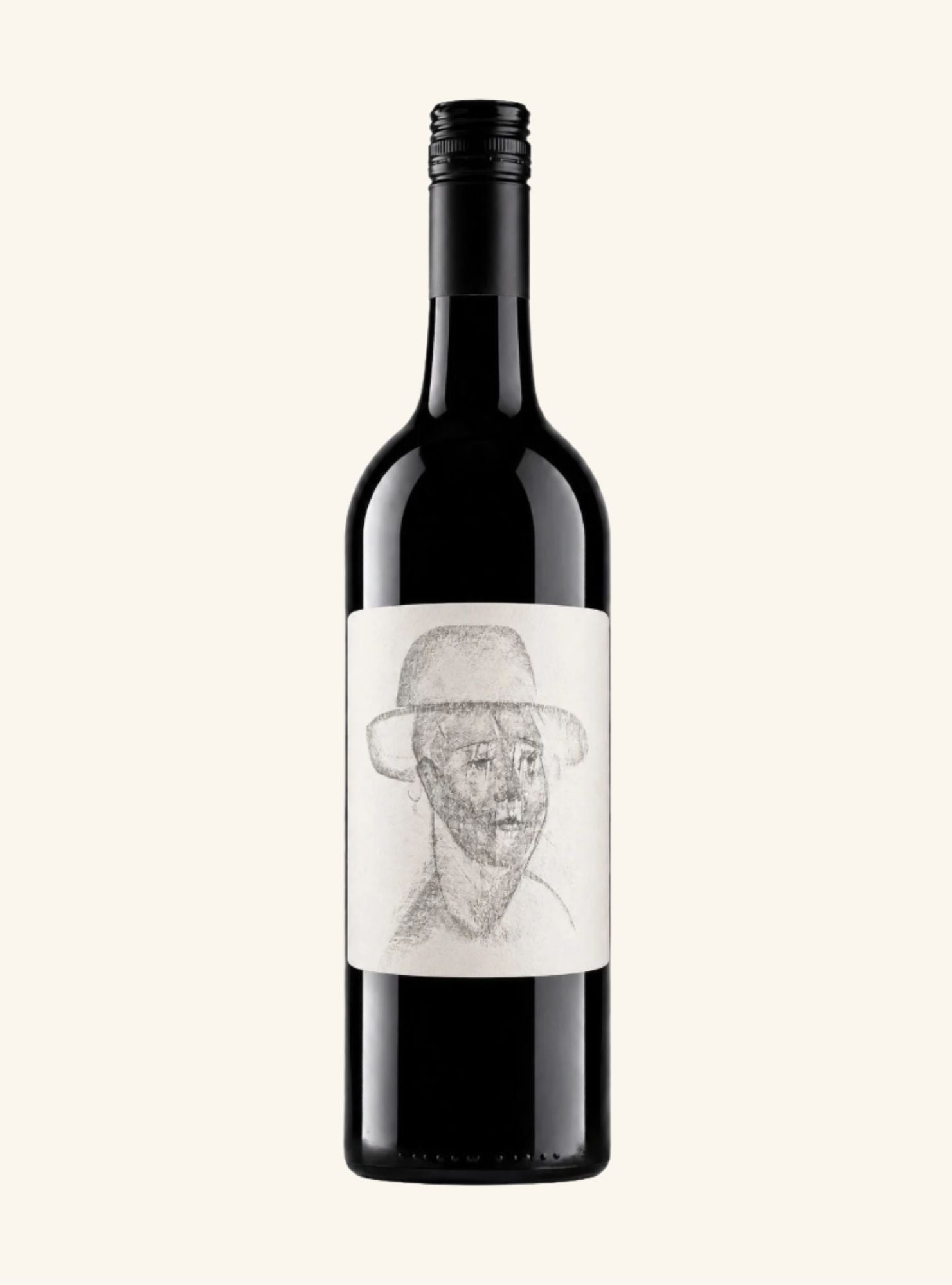 A dark colored wine bottle with a white label set on n off-white background.