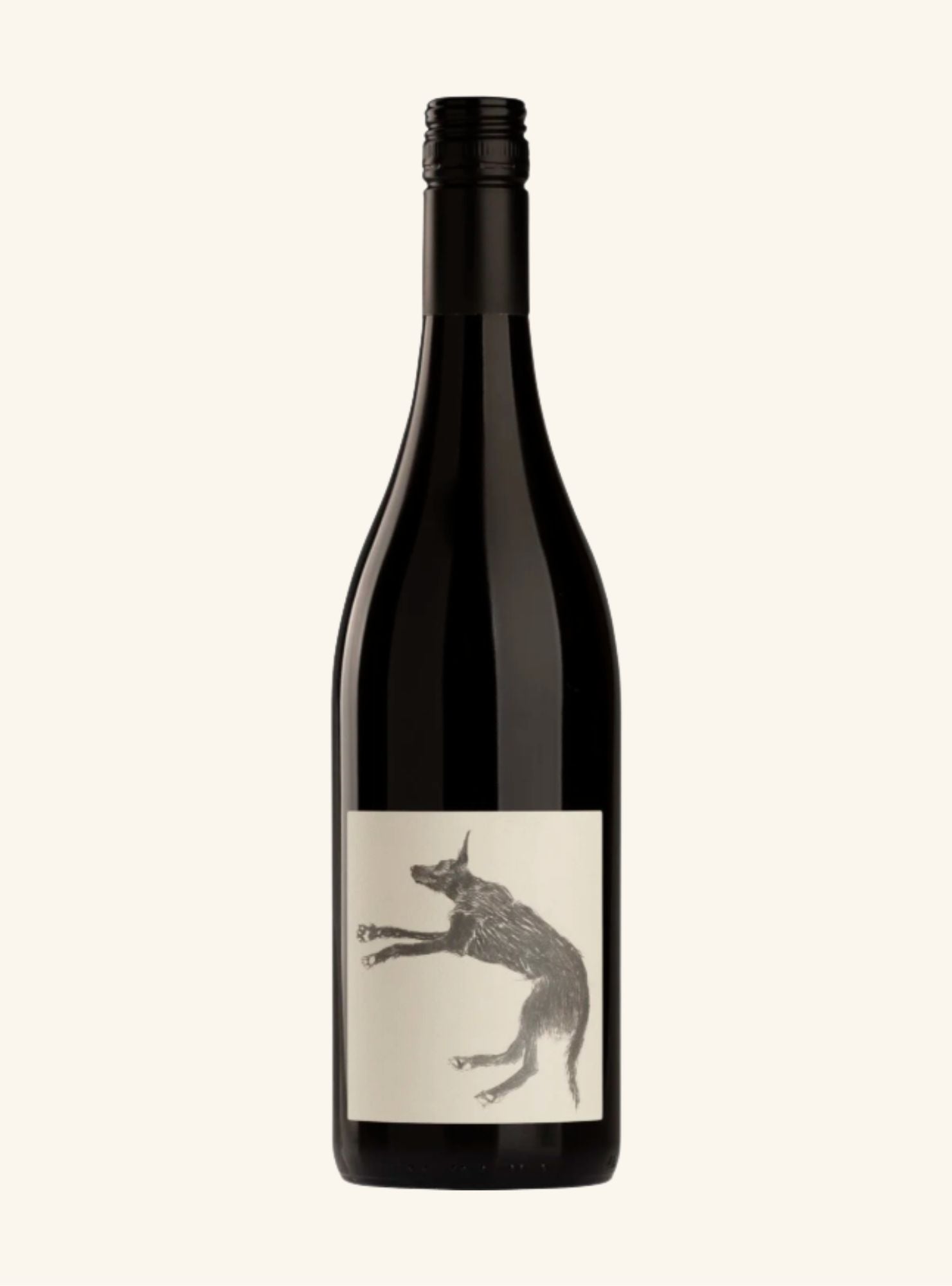 A dark colored wine bottle with a white label set on an off-white background. 