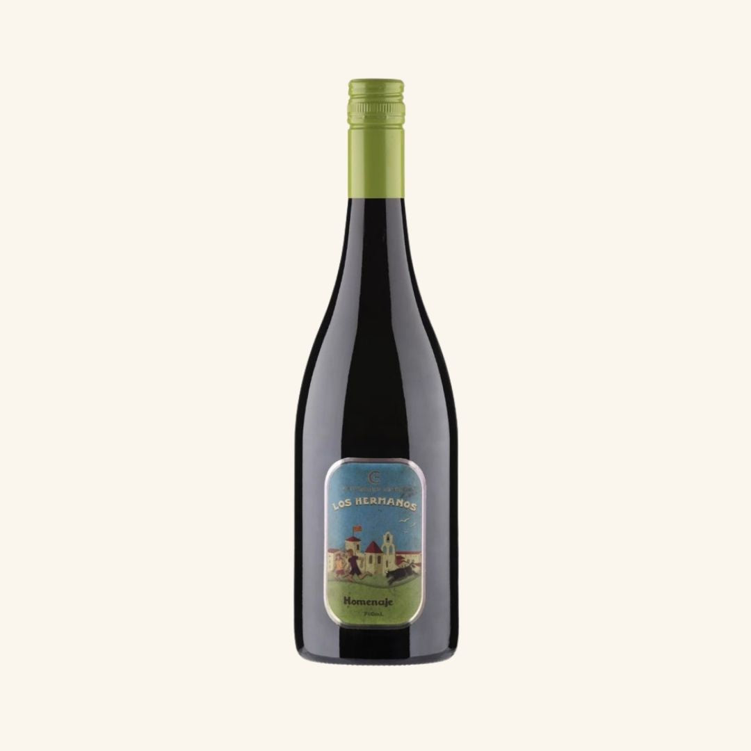 Wine bottle with a green label with Los Hermano Homenaje printing on a white background