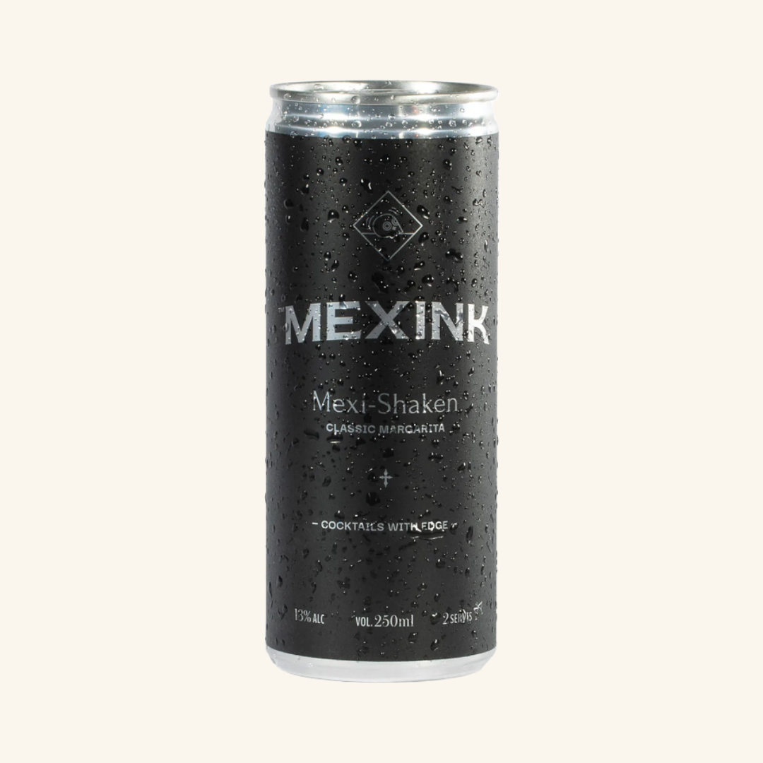 A can of Mexink Mexi-Shaken Classic Margarita cocktail mix, showing the brand name and the text 'Classic Margarita, two servings with DE.' The can is wet and has a black background.