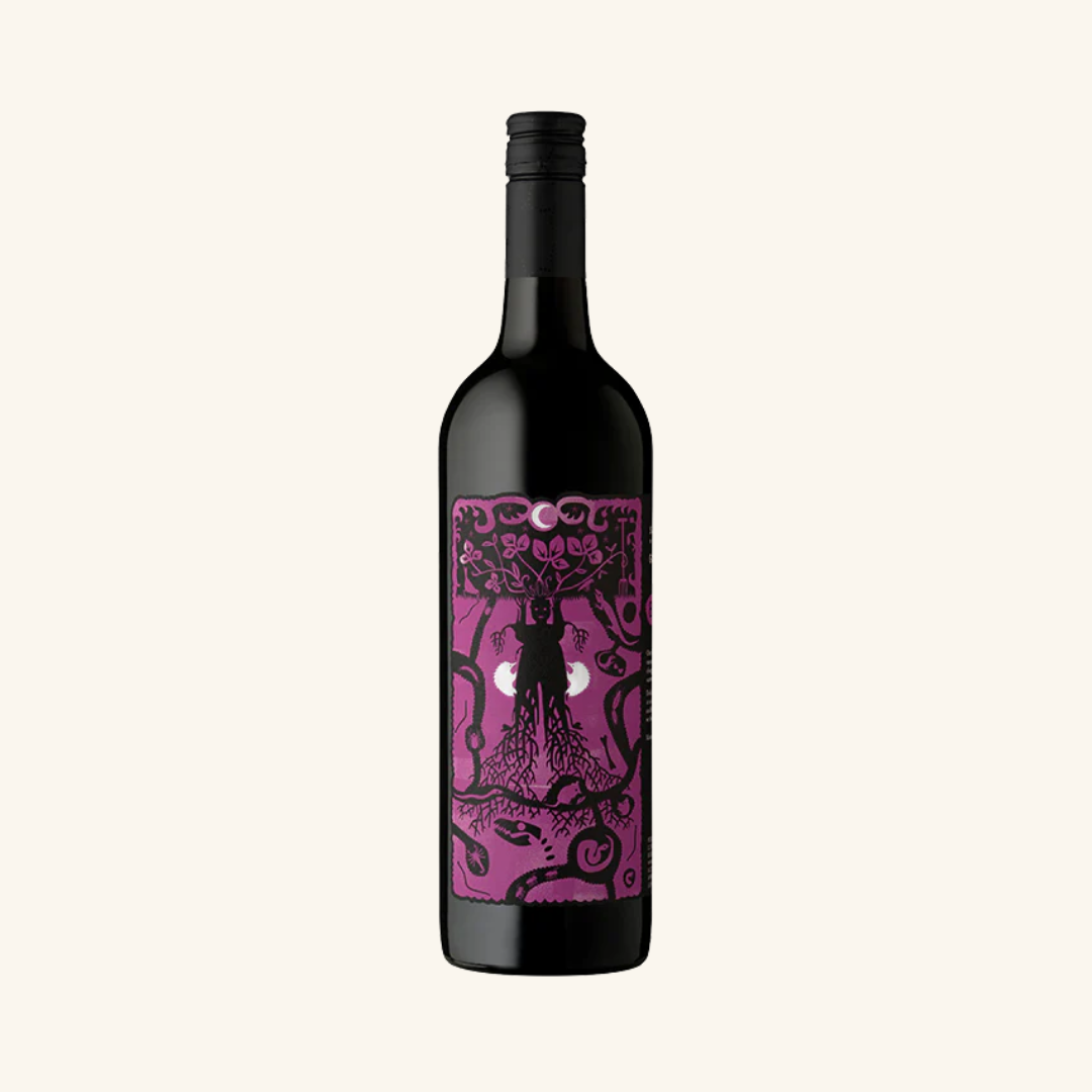 A bottle of SC Pannell Basso Grenache with a purple label featuring an intricate, artistic design.