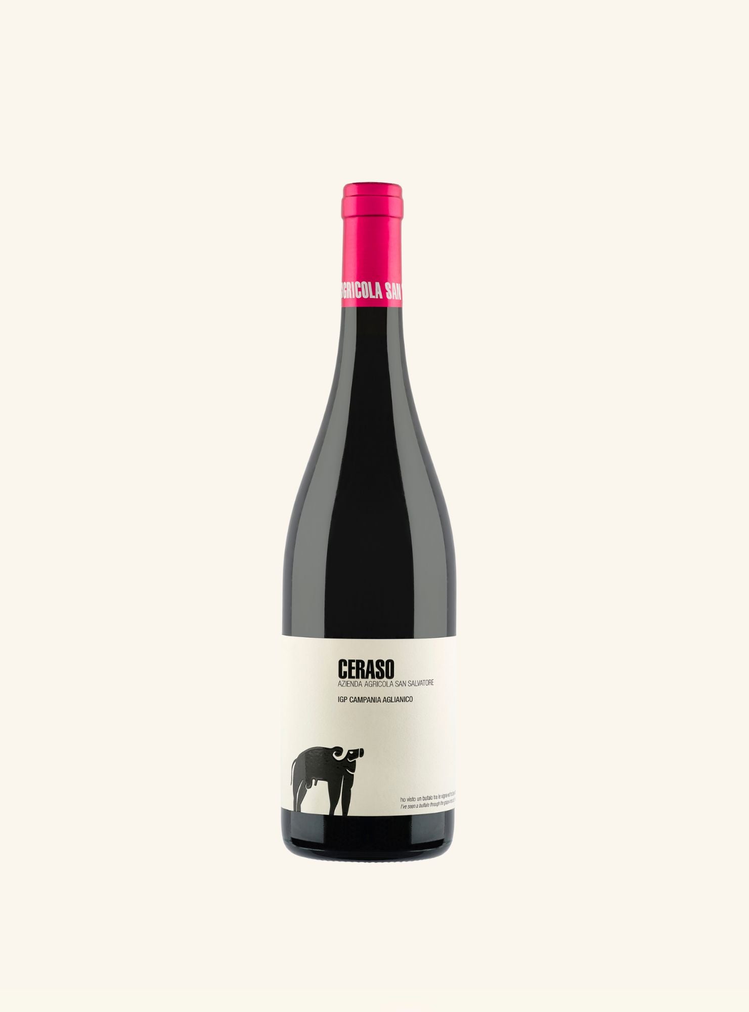 A bottle of Ceraso red wine with a dark glass body, a cream-colored label featuring a black bull graphic, and a bright pink foil capsule at the top, set against a solid off-white background.