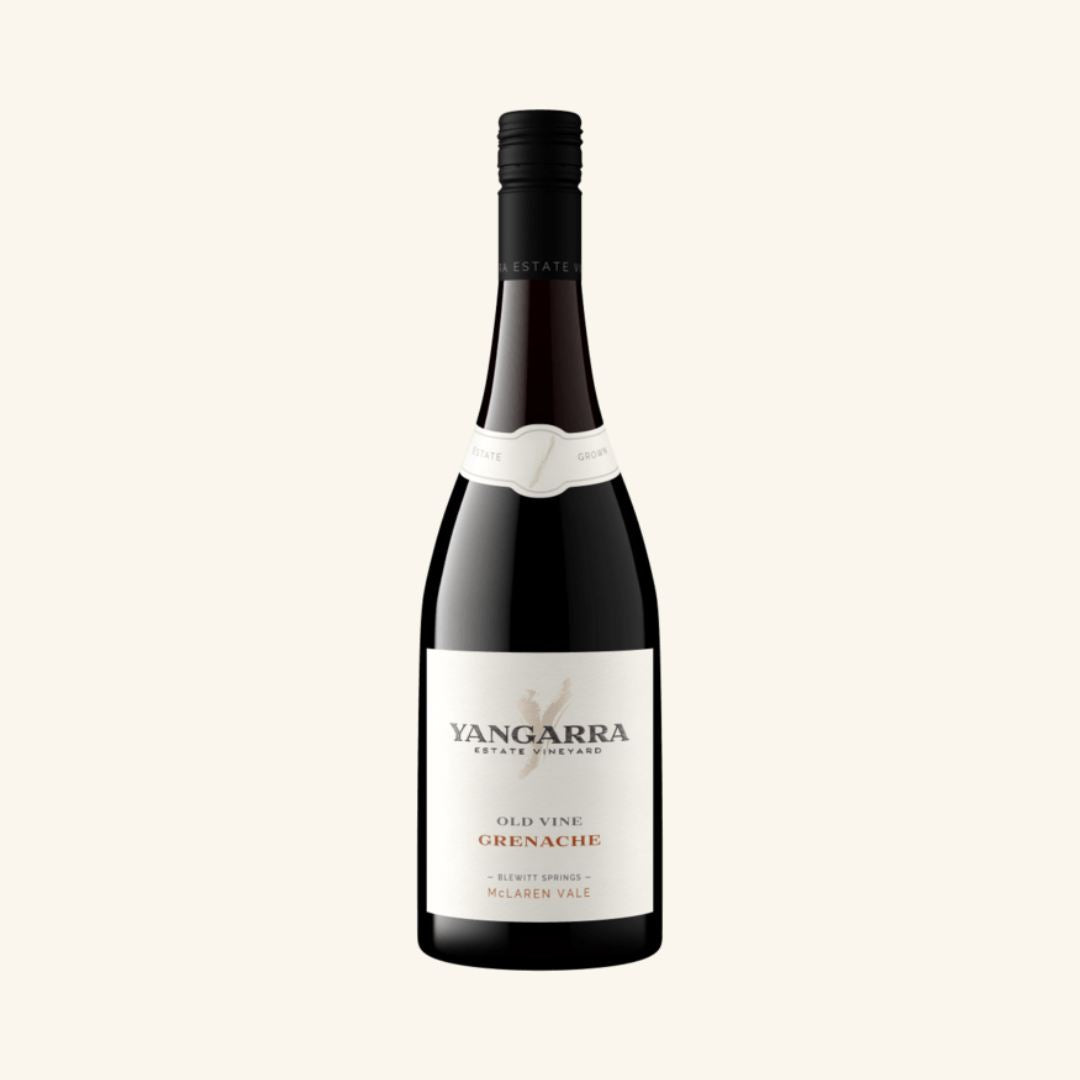 Wine bottle with a white label on a light beige background