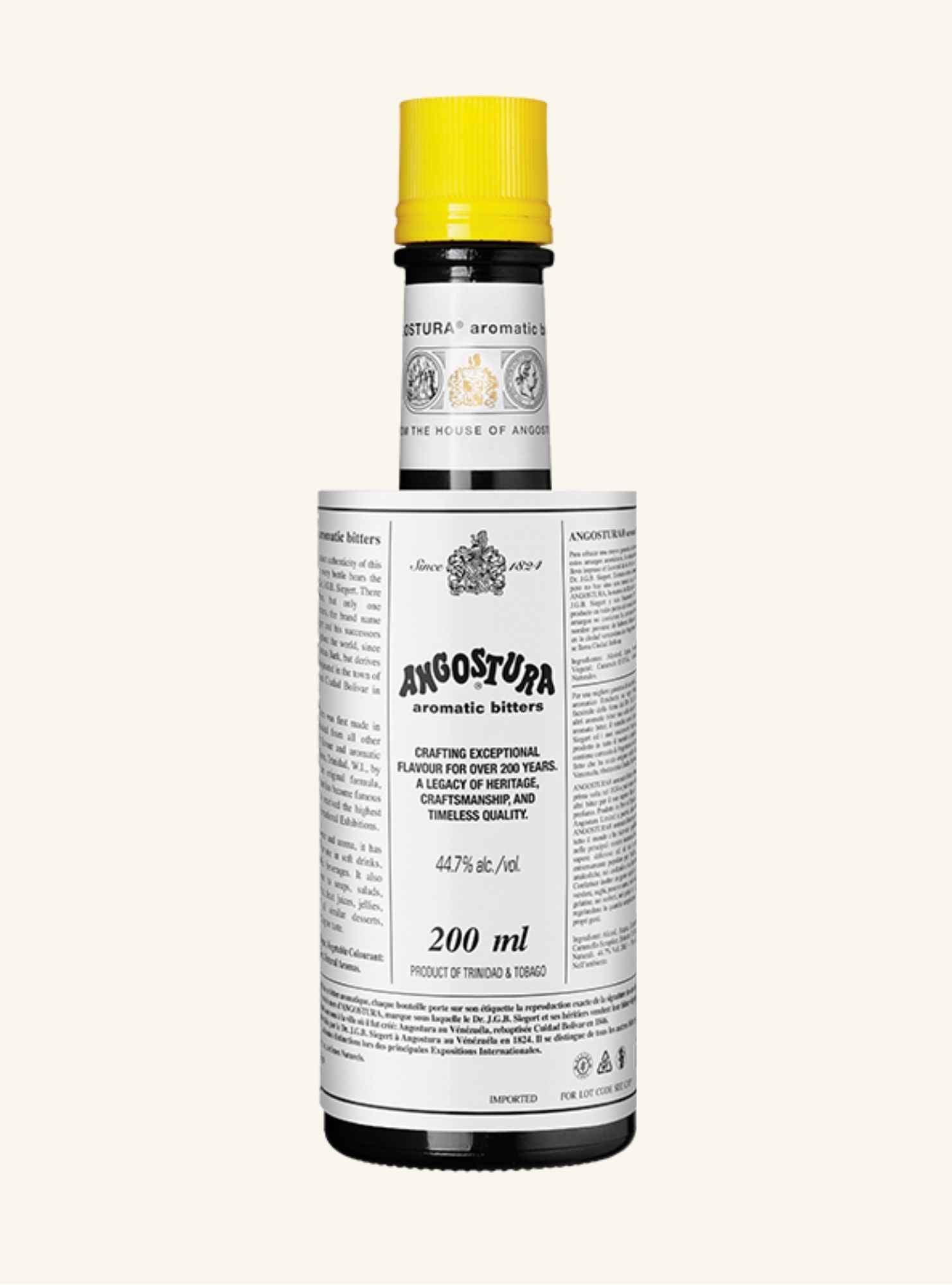 Angostura bitters bottle with a yellow cap on a white background