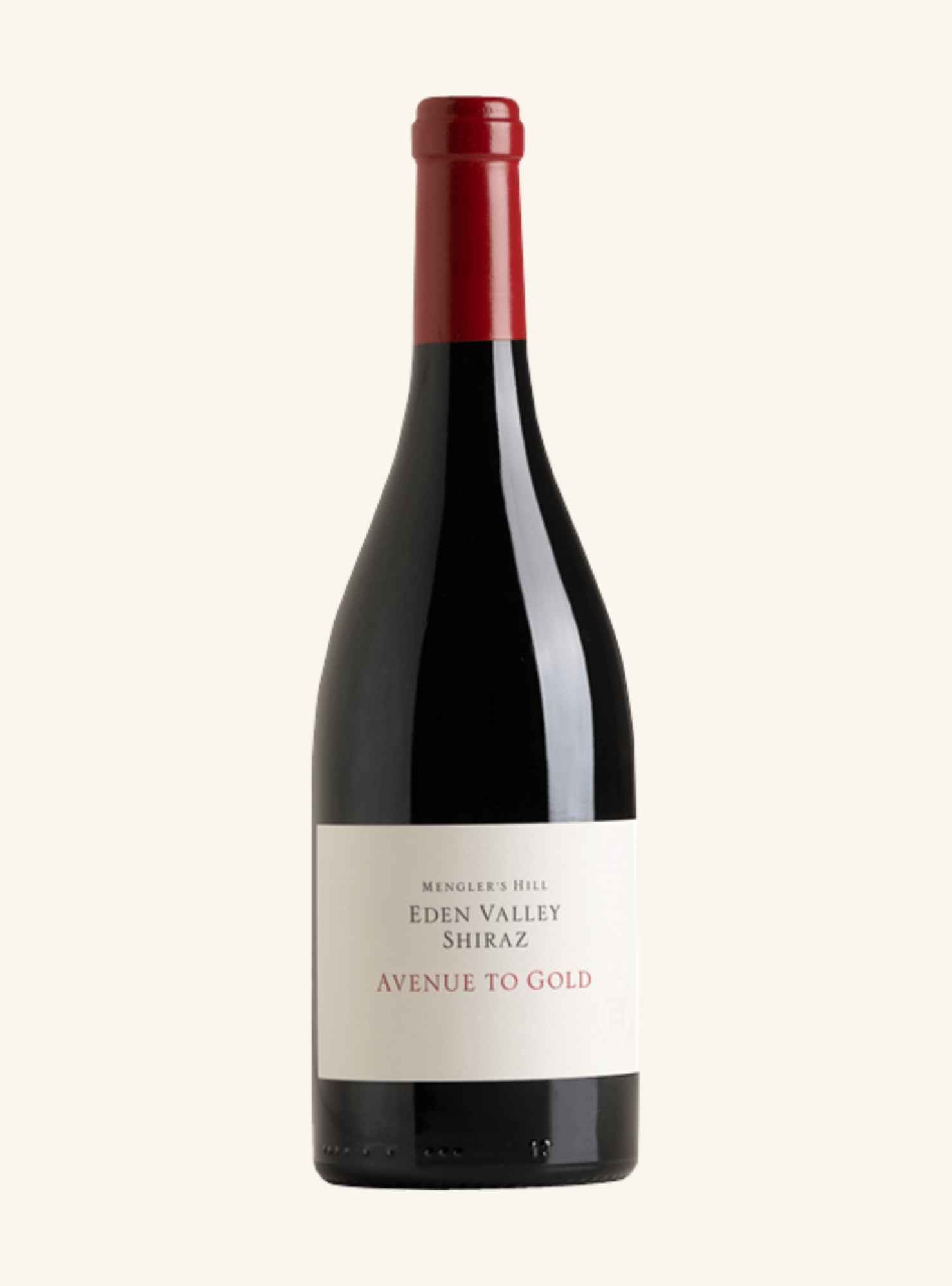 A bottle of Barr-Eden Eden Valley Shiraz 'Avenue to Gold' with a dark glass body, cream label, and red foil on the neck, set against a solid off-white background.