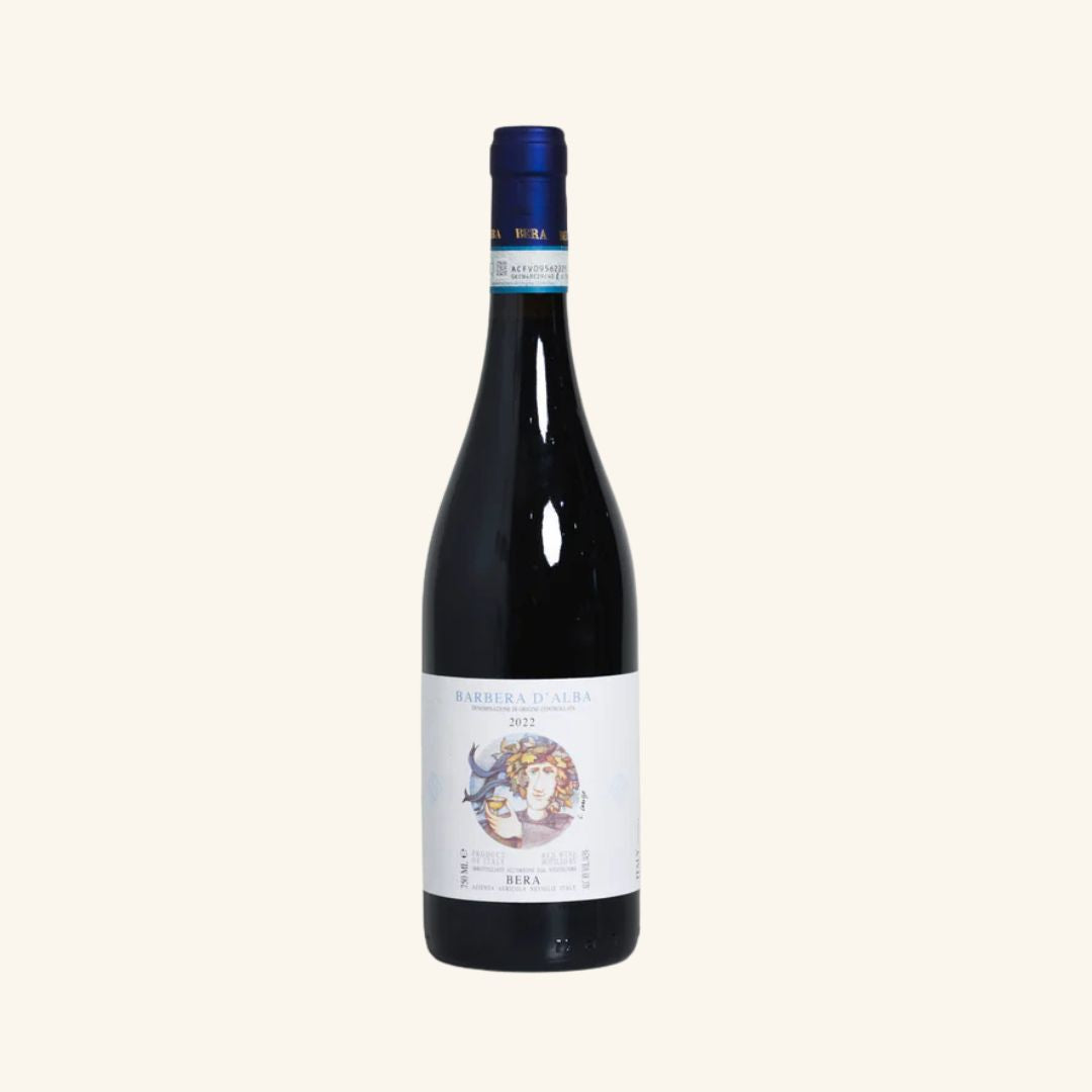 Wine bottle with a label branded Bera Barbera d'alba on a white background