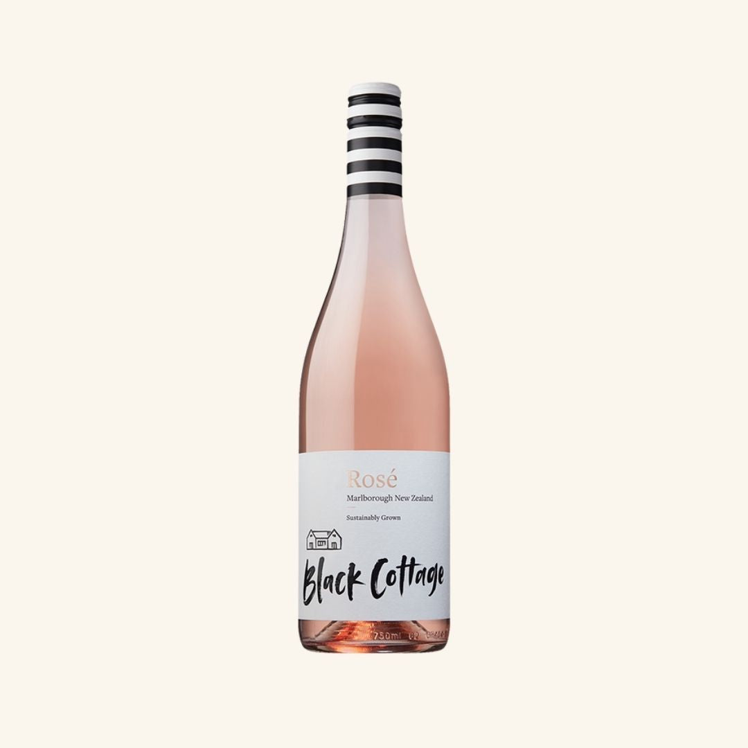 Bottle of Black Cottage Rosé wine on a white background