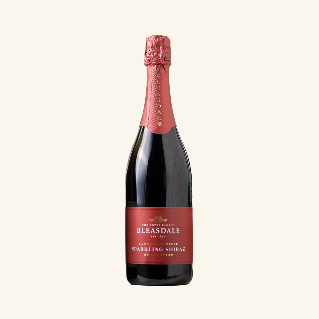 A bottle of Bleasdale Sparkling Shiraz wine with a red label on a white background.