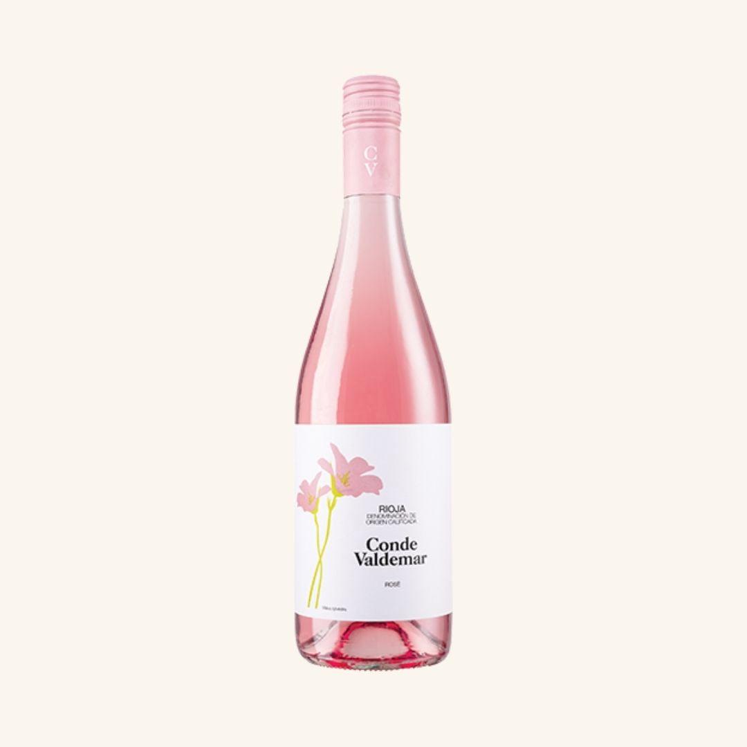 pretty bottle of rose wine labeled Conde valdemar rioja with 2 flowers, on a white background.