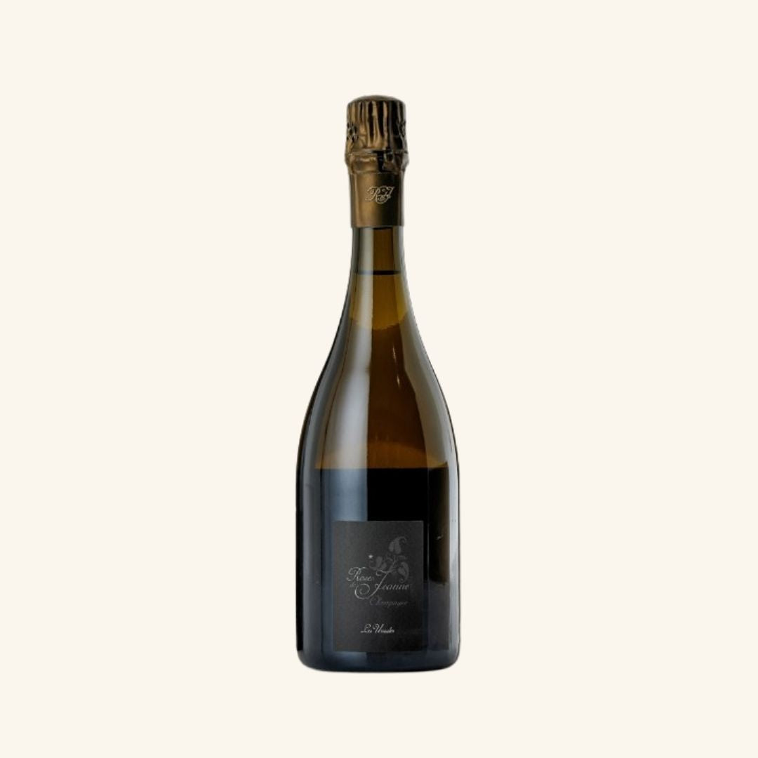 Champagne bottle with a label branded cedric bouchard on a white background