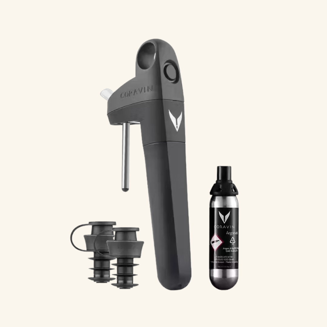 coravin pivot with one gas capsule and 2 stoppers on a white background.