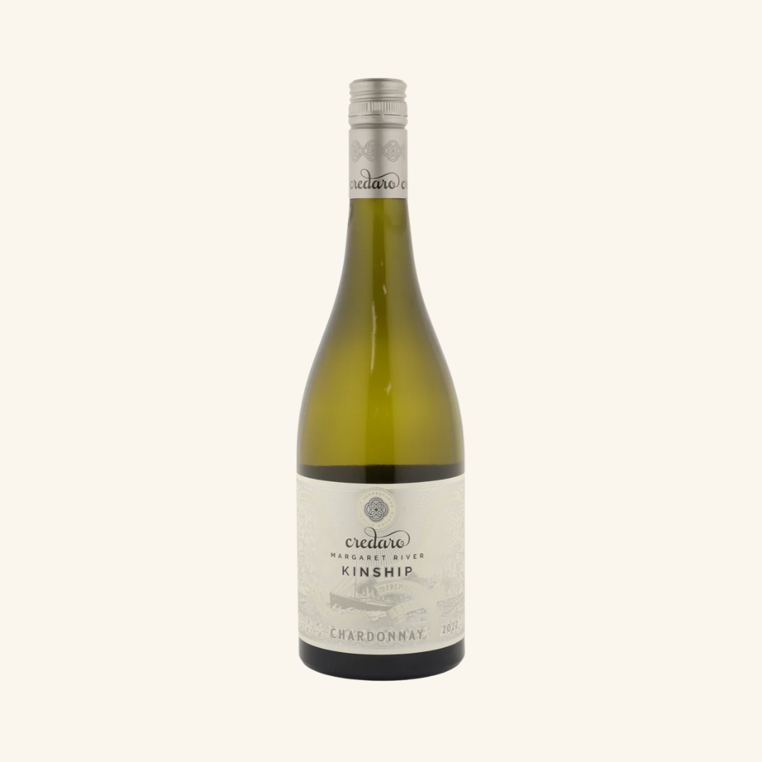 A bottle of Credaro Kinship Chardonnay wine with a label displaying the brand and variety.
