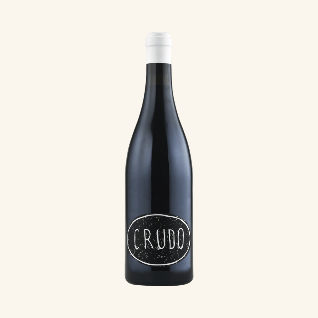 A bottle of Luke Lambert Crudo Shiraz wine with a dark label, on a white background.