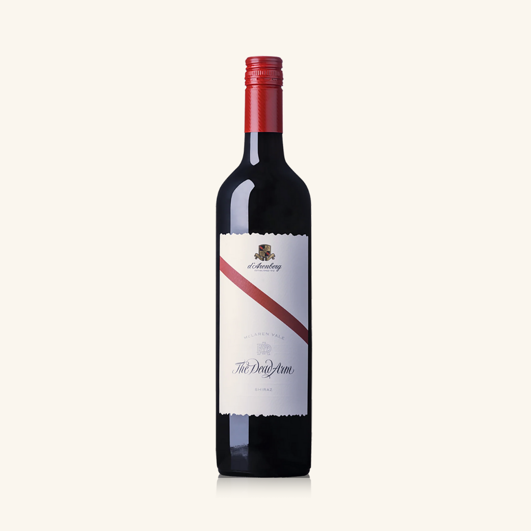 A bottle of d'Arenberg The Dead Arm Shiraz wine with a red stripe across a white label and red cap.