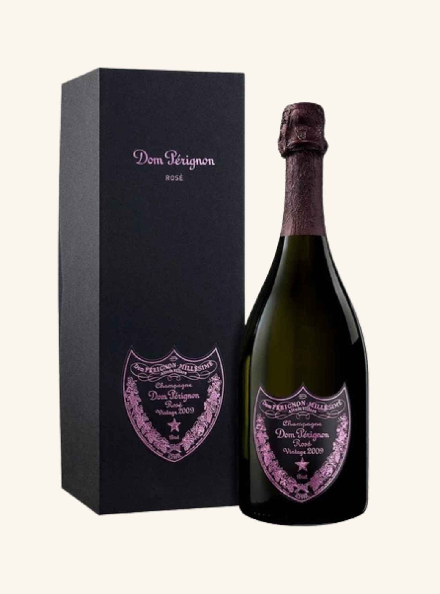 Dom Régnon Rose champagne bottle next to its black presentation box, both featuring a purple and gold shield emblem, set against a solid off-white background.