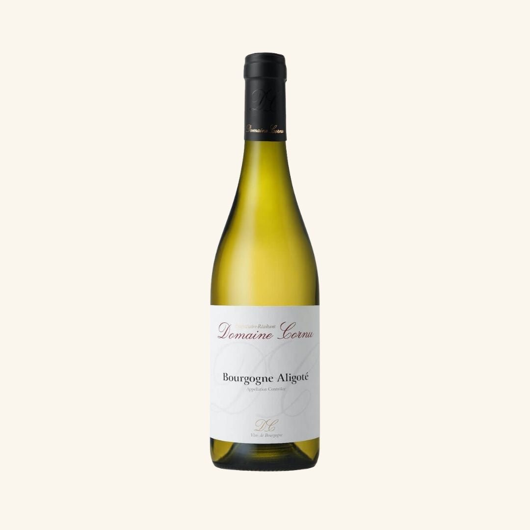 Wine bottle with a white label with Domaine Cornu Bourgogne Aligote branding on a light beige background