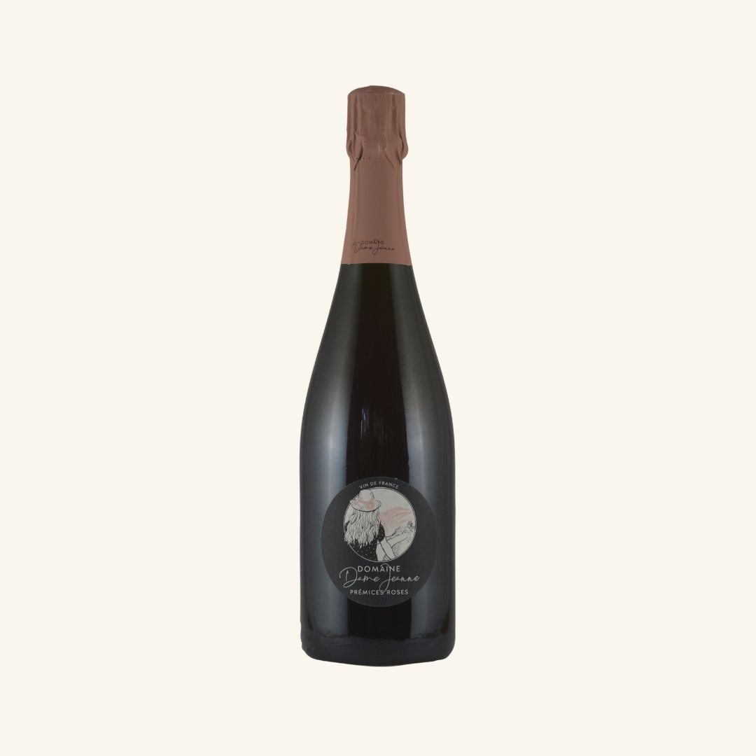 Bottle of domaine dame jeanne premices rose sparkling on a white background