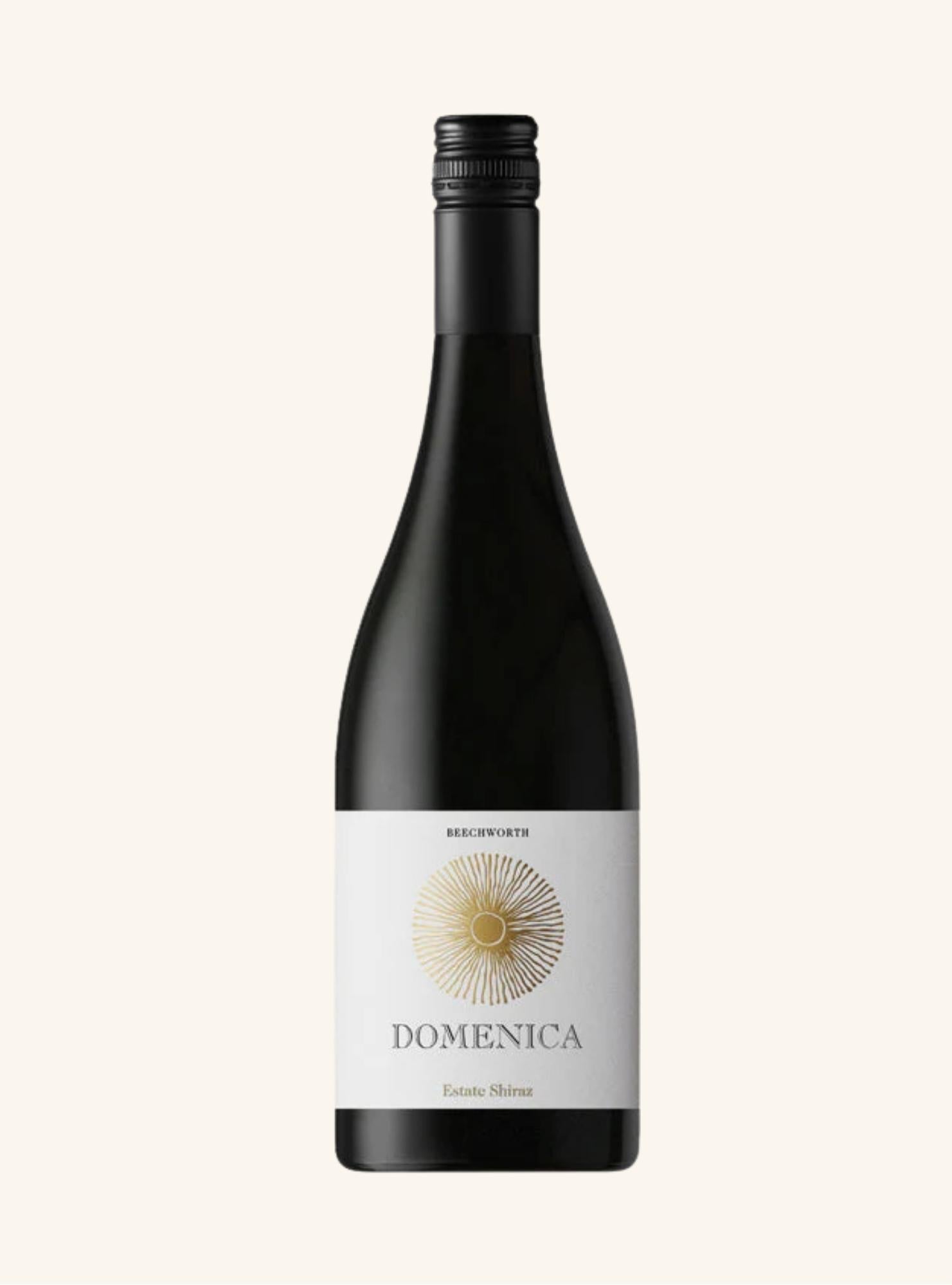 Wine bottle with 'Domenica Estate Shiraz' label on a white background