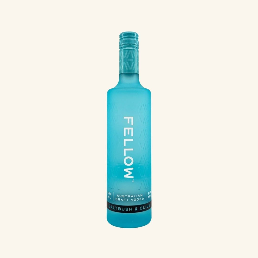 Blue bottle of Fellow vodka saltbush and olive in a bright blue bottle on a white background