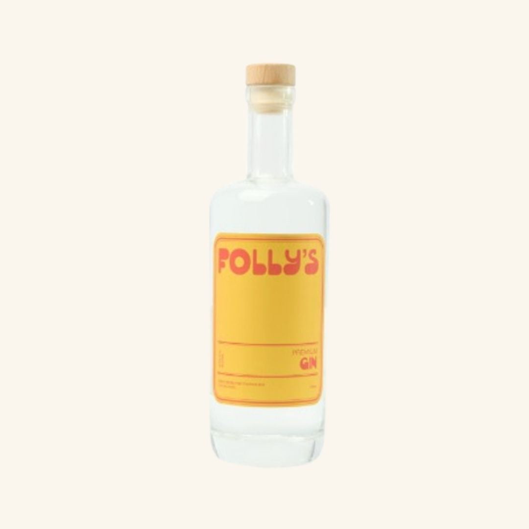 Bottle of Polly's Gin with a yellow label on a white background