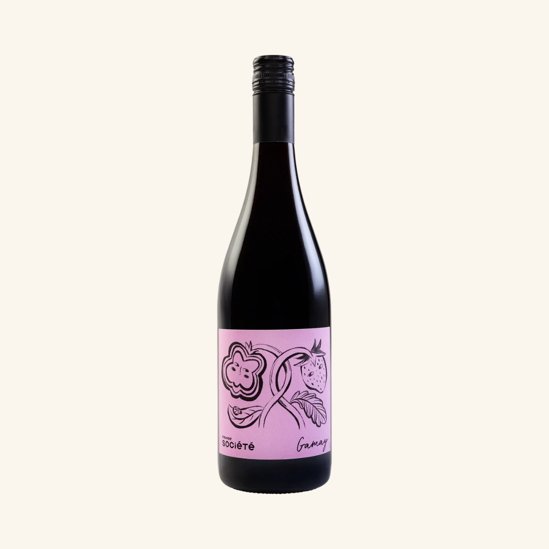 A bottle of Fringe Société Gamay wine with a label that has a pink and purple illustration and text.