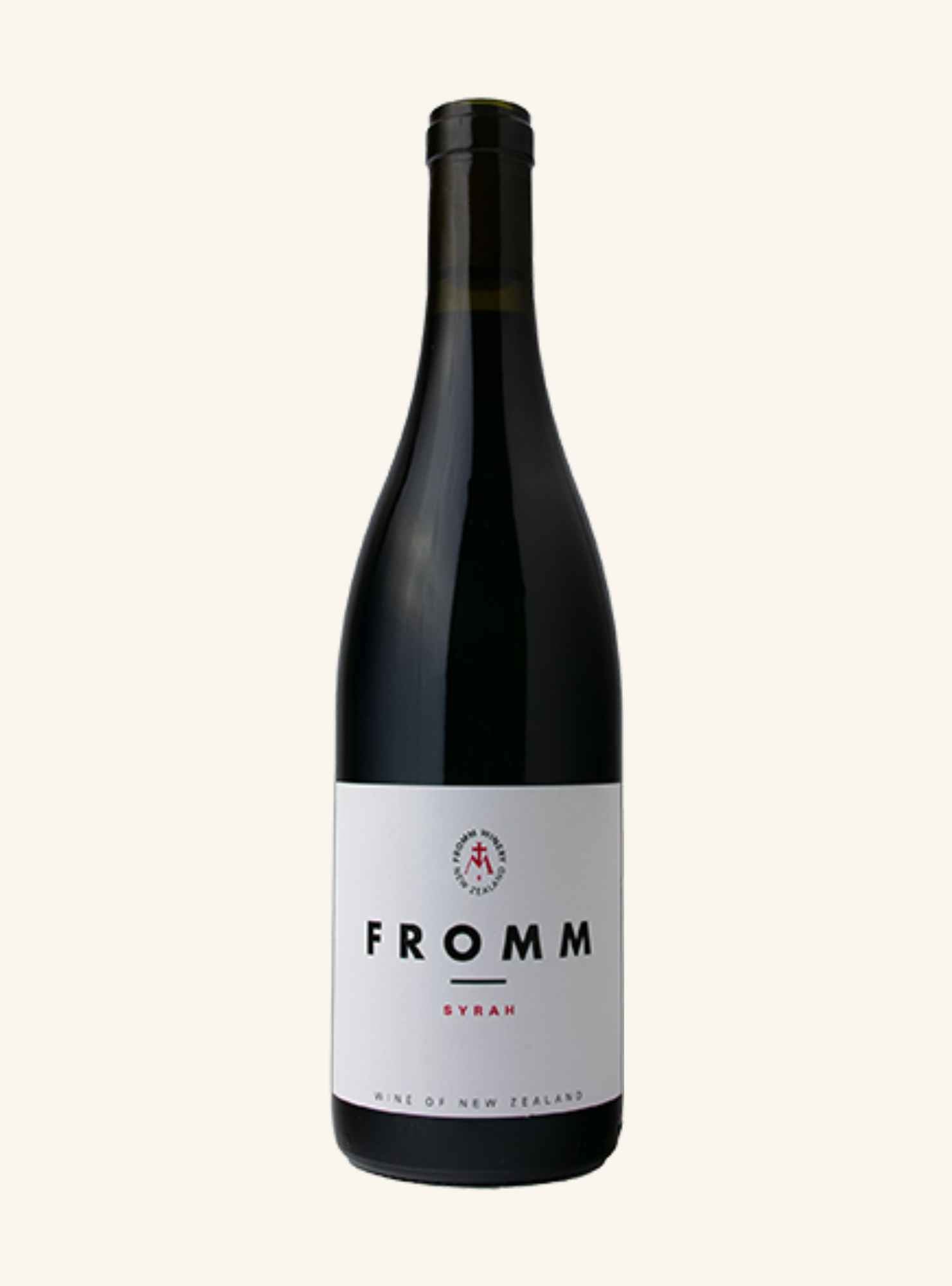 A bottle of Fromm Syrah red wine with a white label and black bottle, centered on a light cream background.