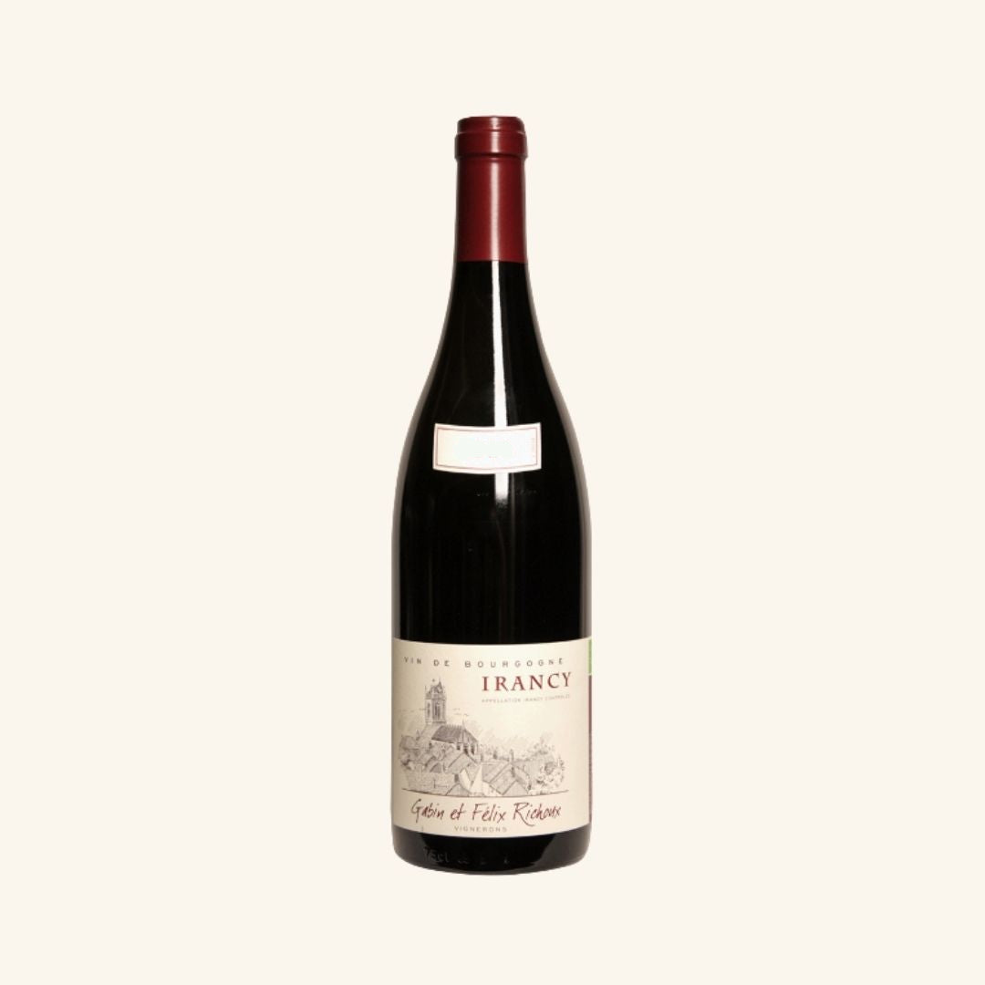 Red wine bottle with a visible label branded 'Irancy gabin et felix richoux' on a white background