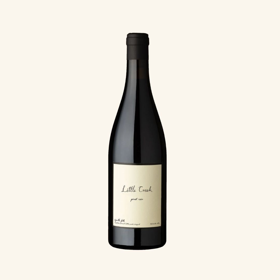 Wine bottle with 'Little Creek pinot noir gentle folk' label on a white background