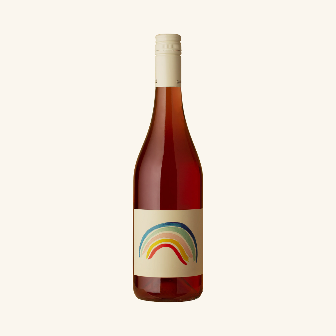 A bottle of Gentle Folk Rainbow Juice wine with a colorful label featuring a rainbow.
