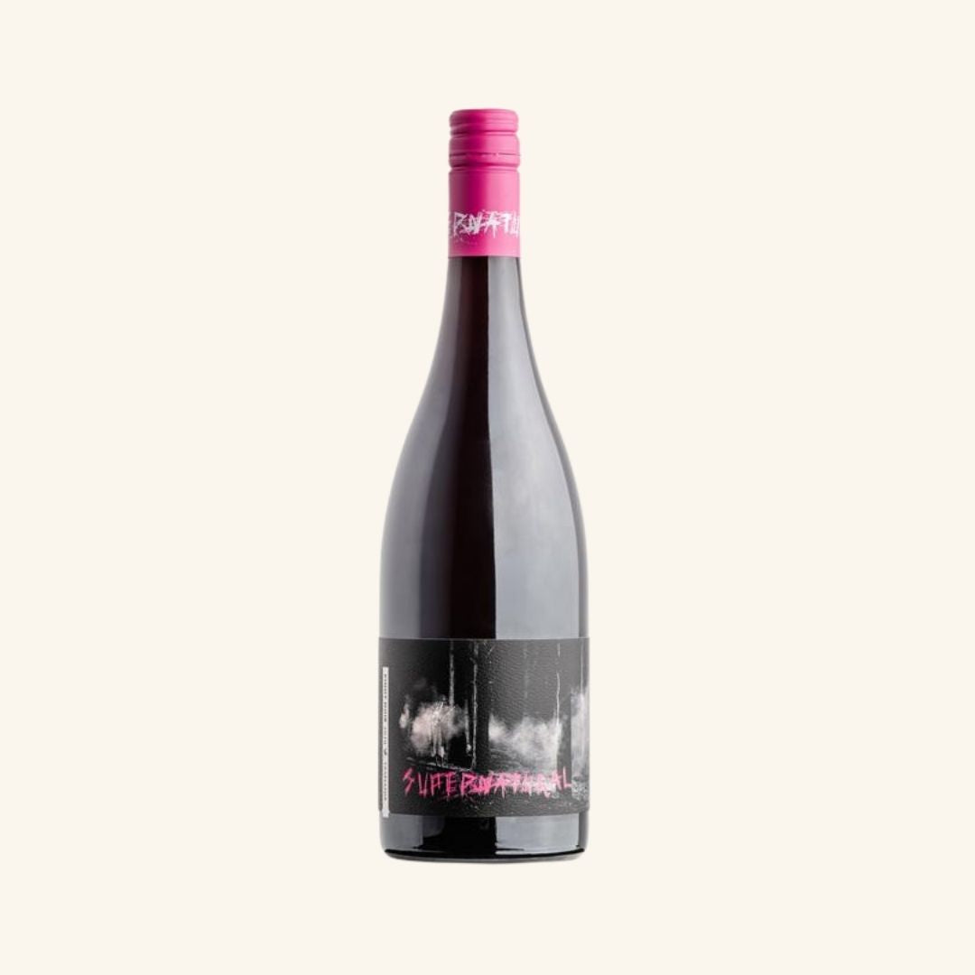Wine bottle with a pink label branded supernatural on a white background