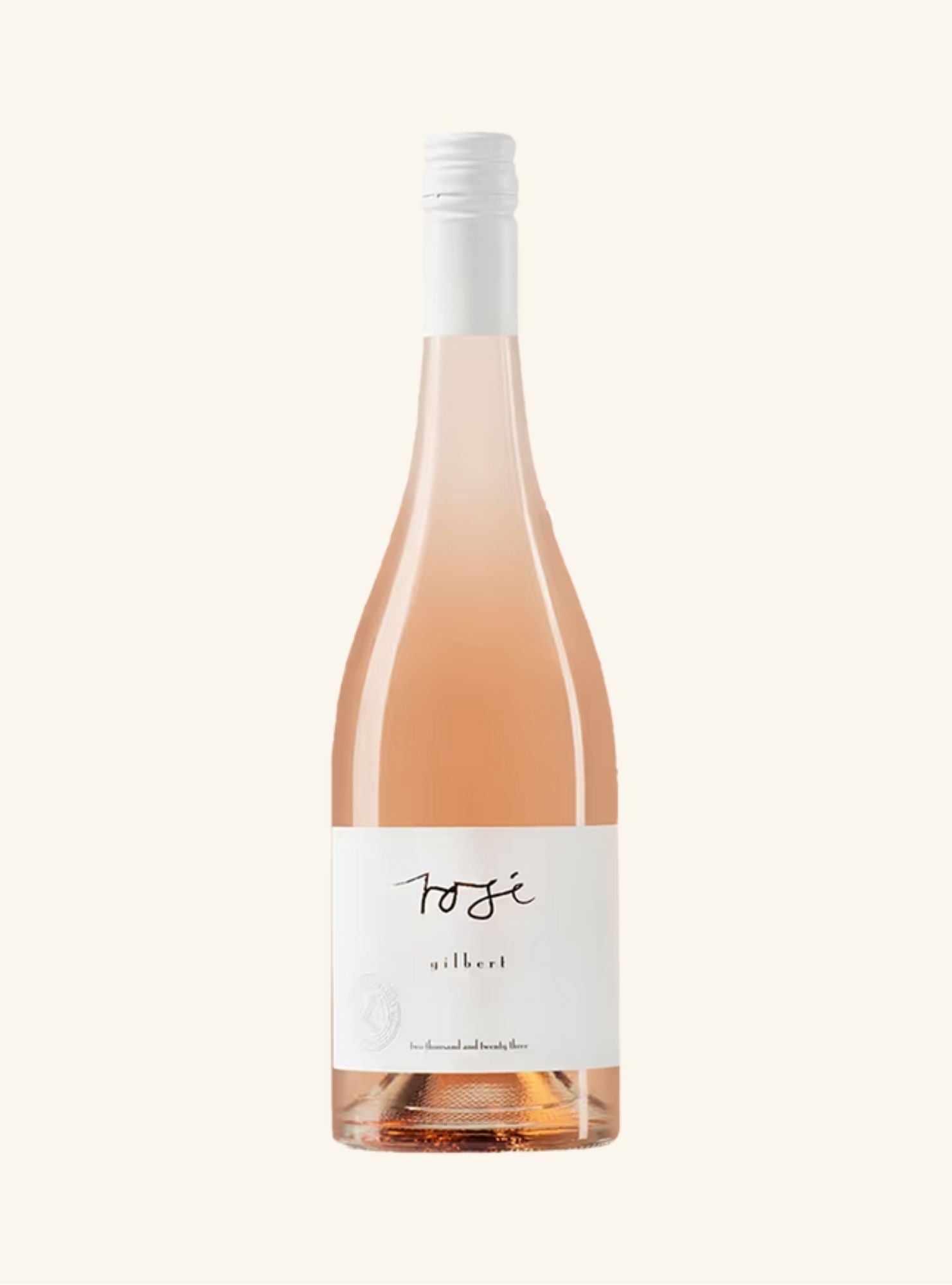 Bottle of gilbert Rosé wine with a white label on a light beige background