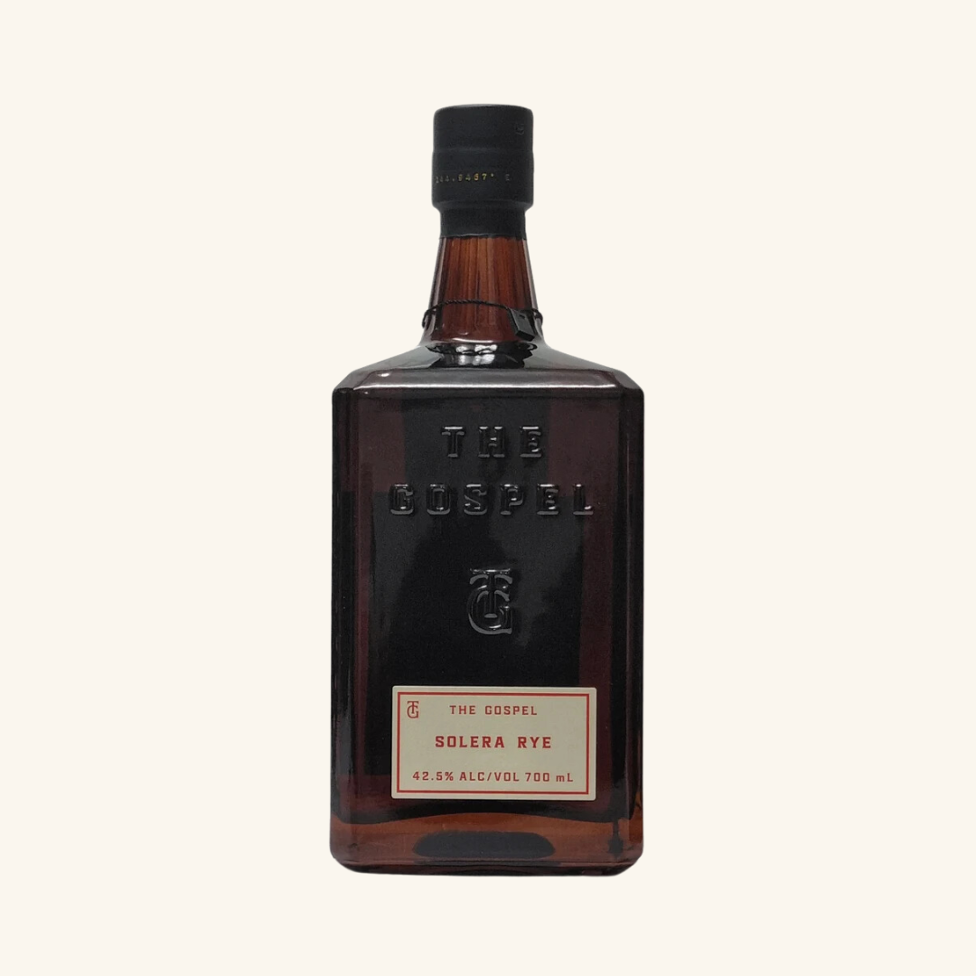 A bottle of Gospel Rye whiskey with a label that reads 'The Gospel Solera Rye 43% alcohol by volume'.