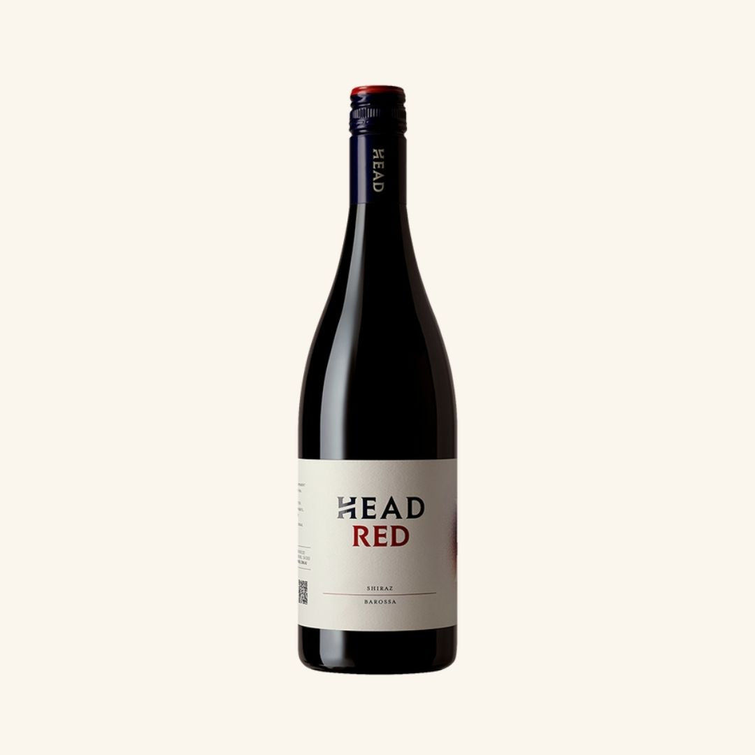 Bottle of 'HEAD RED' wine on a white background