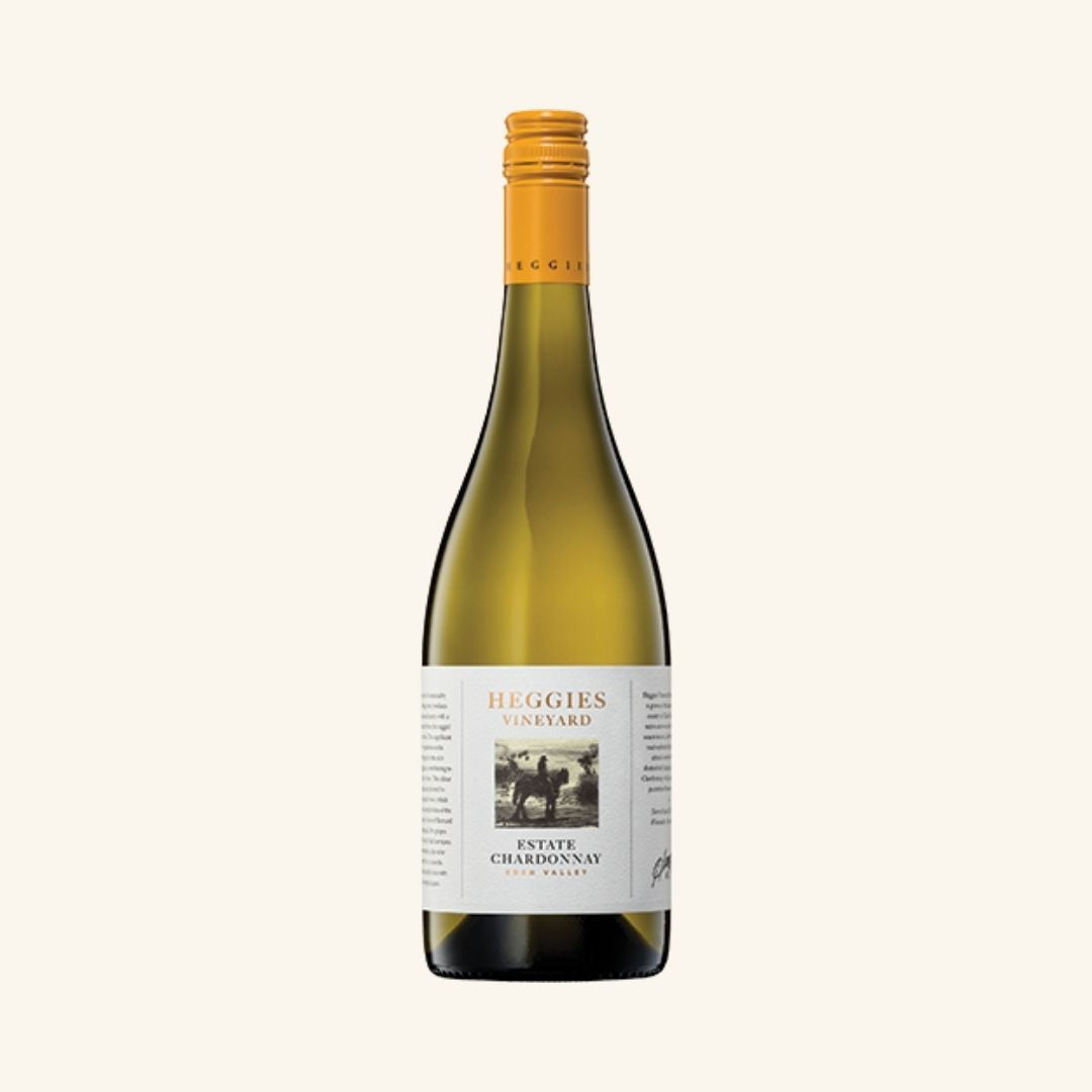 Wine bottle with a label branded heggies vineyard estate chardonnay, with a yellow cap, on a white background