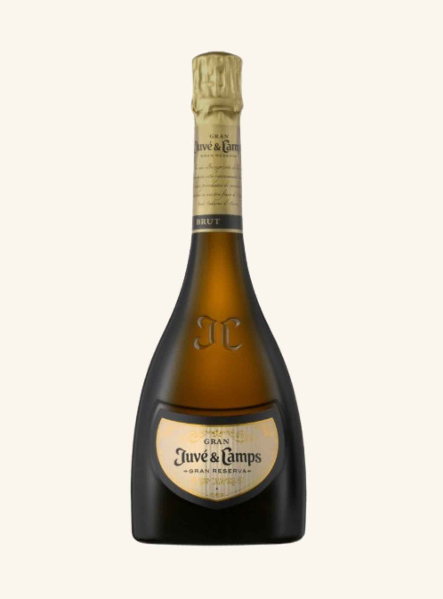 A bottle of Gran reserva Juvé & Camps Brut sparkling wine, featuring a dark glass bottle with a gold foil top and a cream-colored label, set against a solid off-white background.