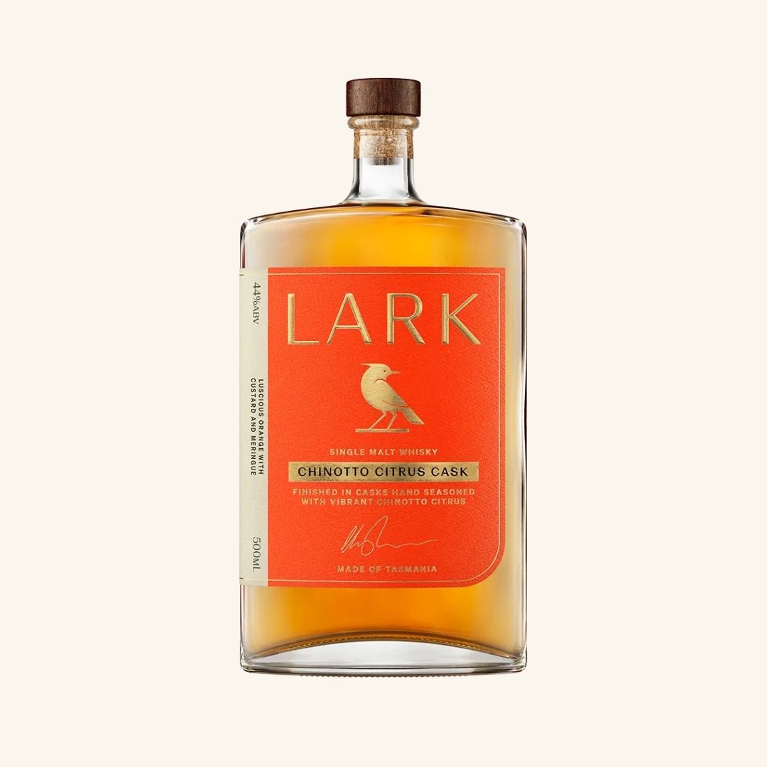 Bottle of Lark chinotto citrus cask whiskey with an orange label on a white background
