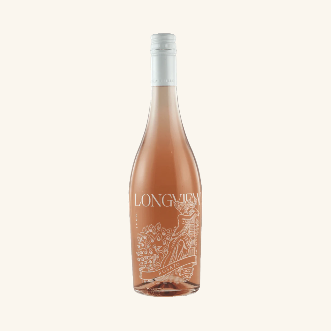 A bottle of Longview Juno Nebbiolo Rosato wine with a pink hue and label that features floral and figurine illustrations.
