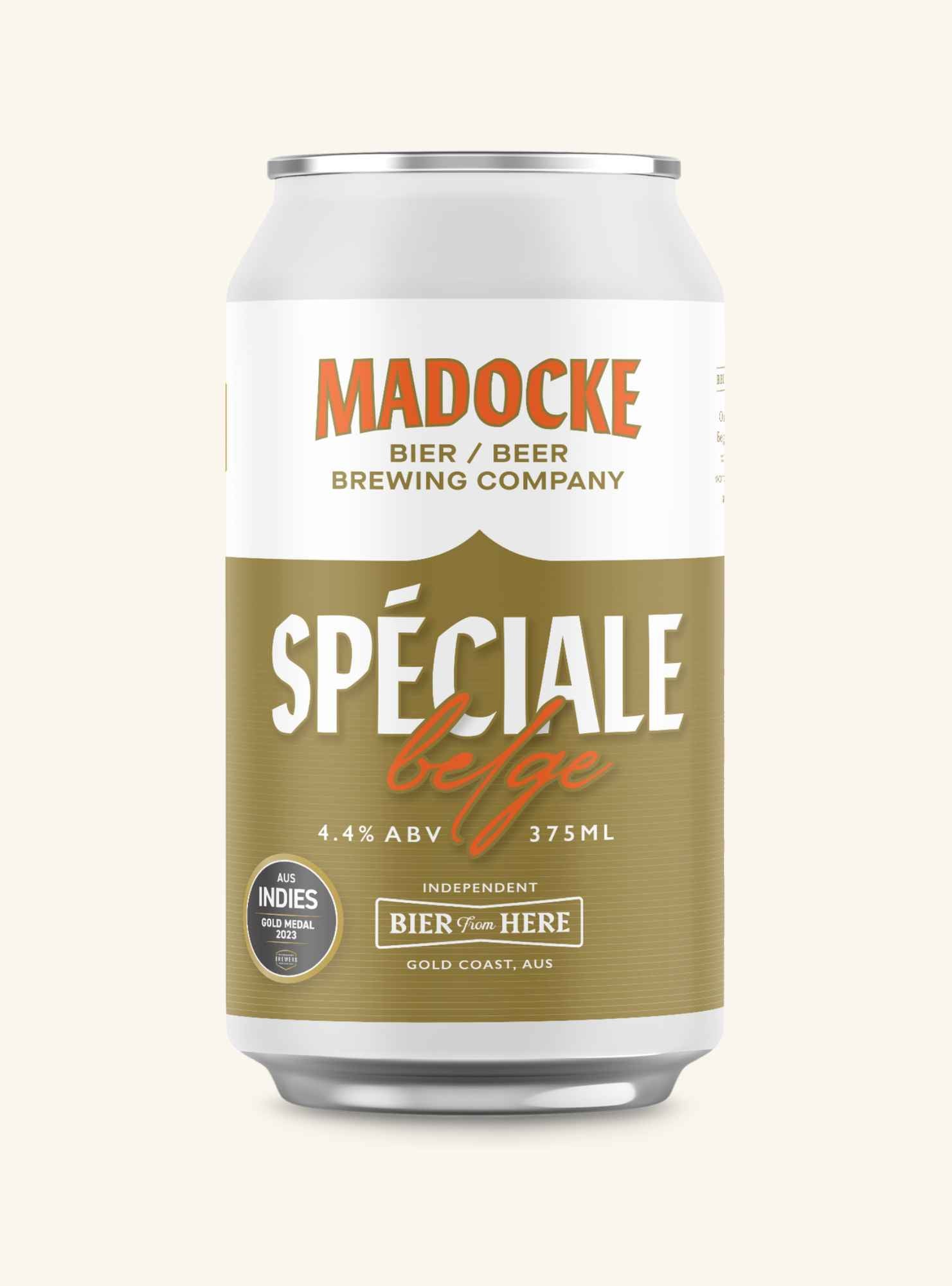 A 375ml aluminum can of Madocke Spéciale Belge beer, featuring a white top label and a textured olive-gold lower label with white and orange text, set against a solid cream background.