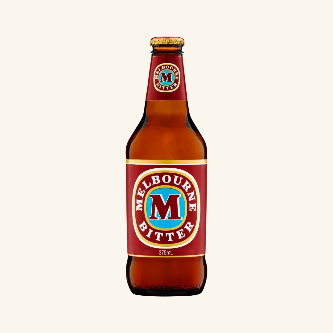 Melbourne Bitter beer bottle with red label on a white background