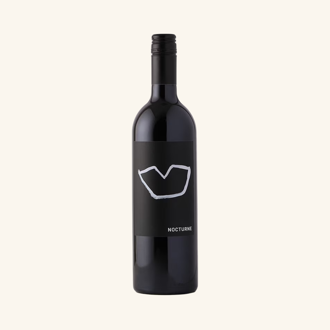 A bottle of Nocturne SR Cabernet Merlot Blend red wine with a dark label.