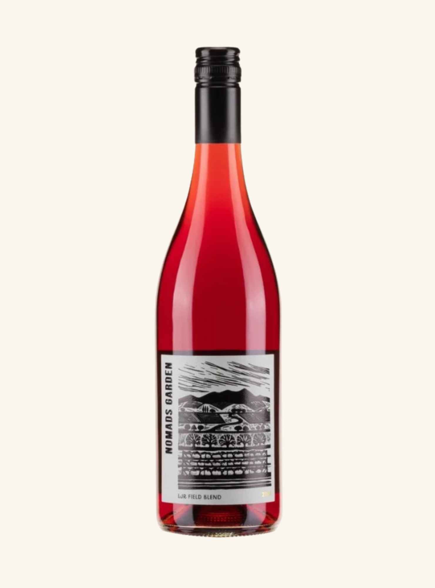 A bottle of red wine with a black screw cap and a black-and-white label reading 'Nomads Garden' and 'LJR field Blend', centered on a light cream background.