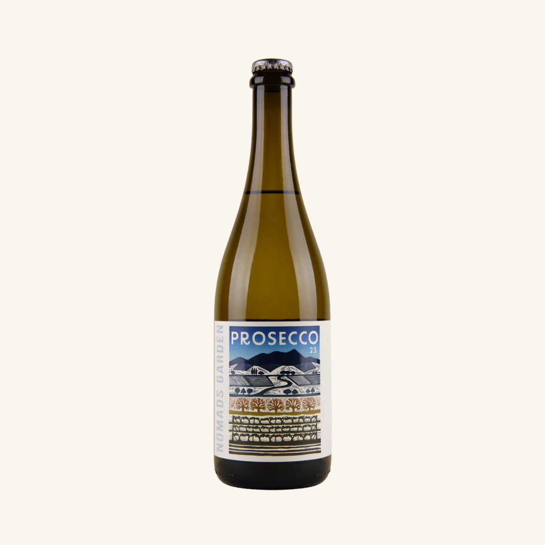 A bottle of Nomads Garden Prosecco sparkling wine with a label that includes the variety 'Glera' and the phrase 'A sparkling wine made with love in the King Valley'.