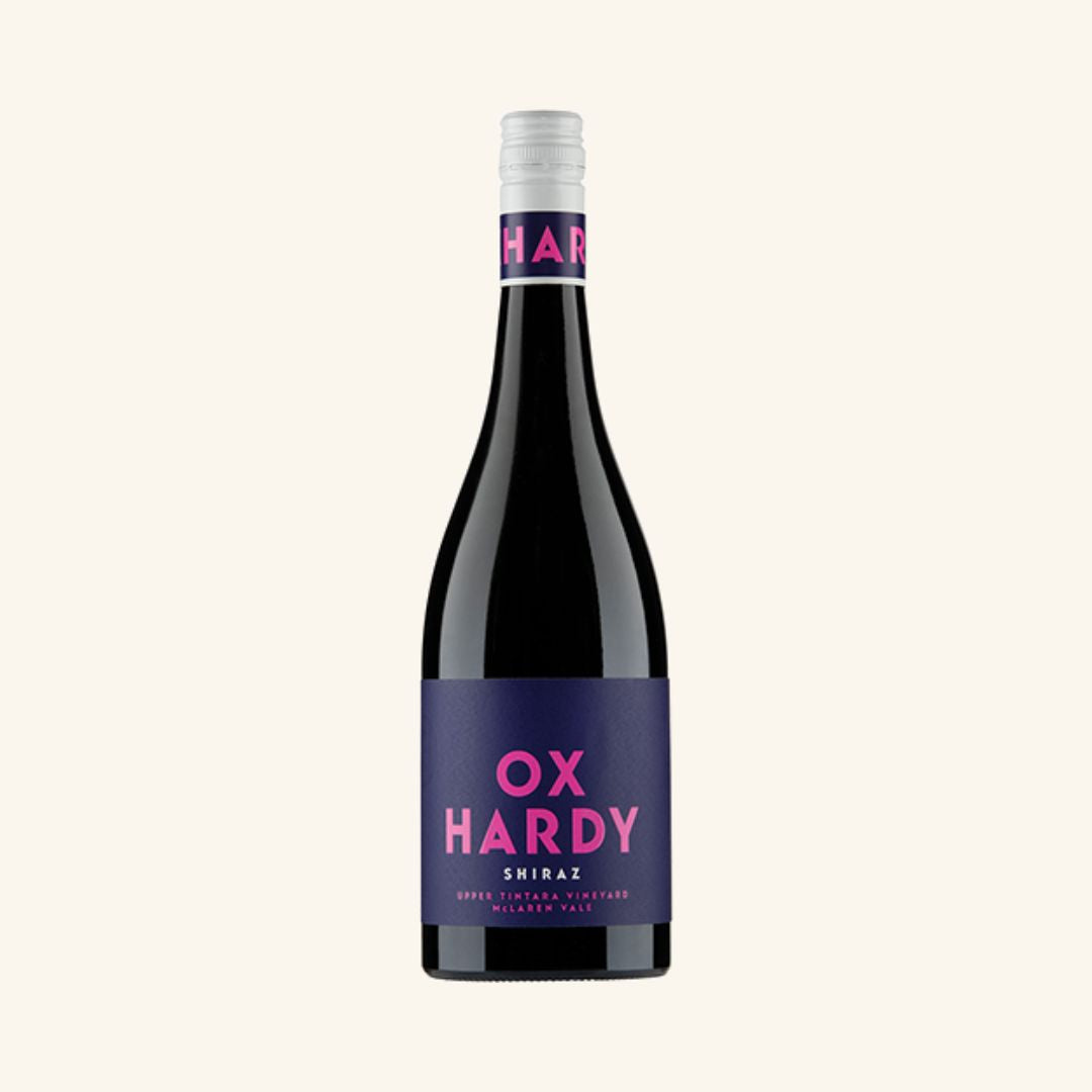 Wine bottle of Ox Hardy Shiraz with purple label on a white background
