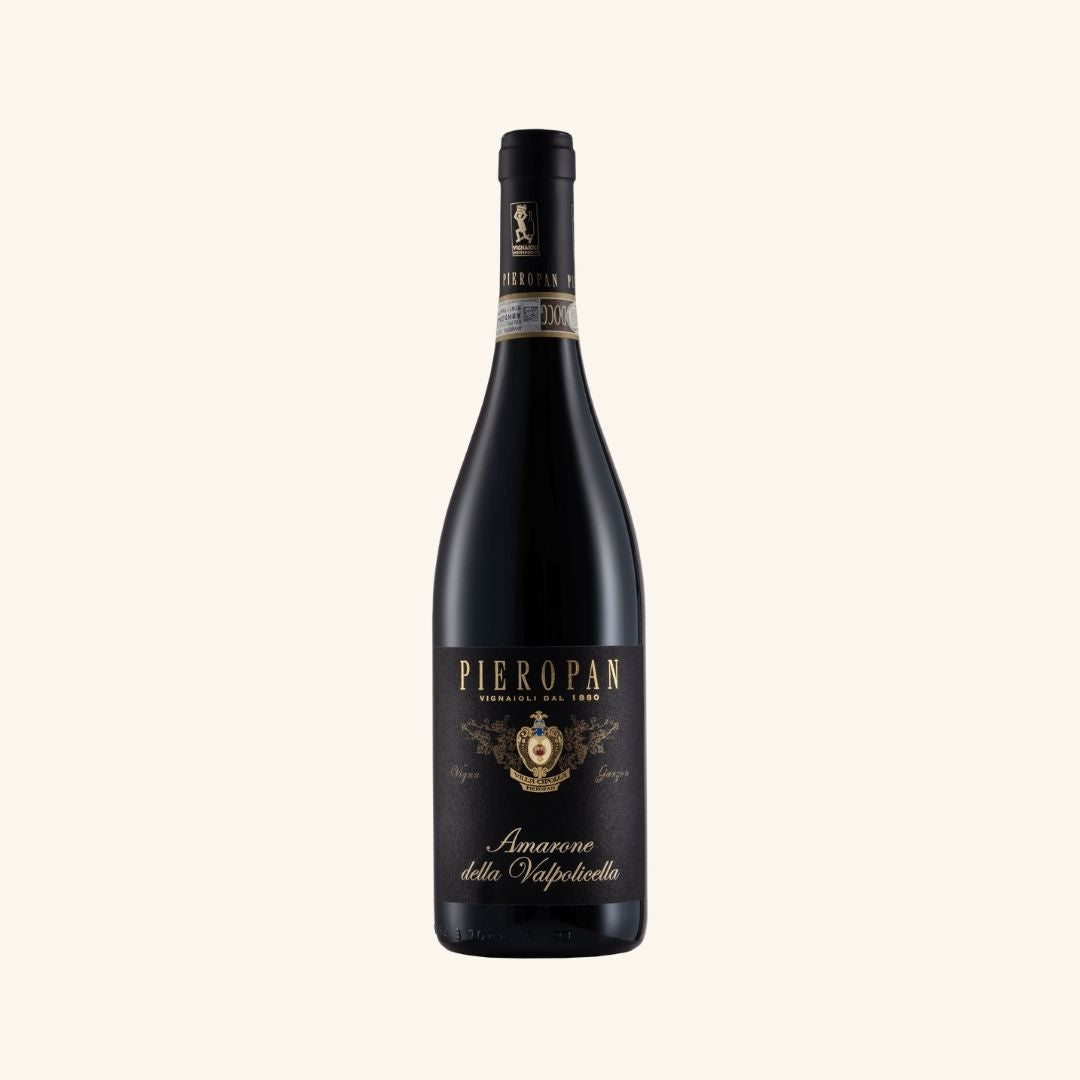 wine bottle with a black label with gold branding Pieropan amarone della valpoliclla on a white background.