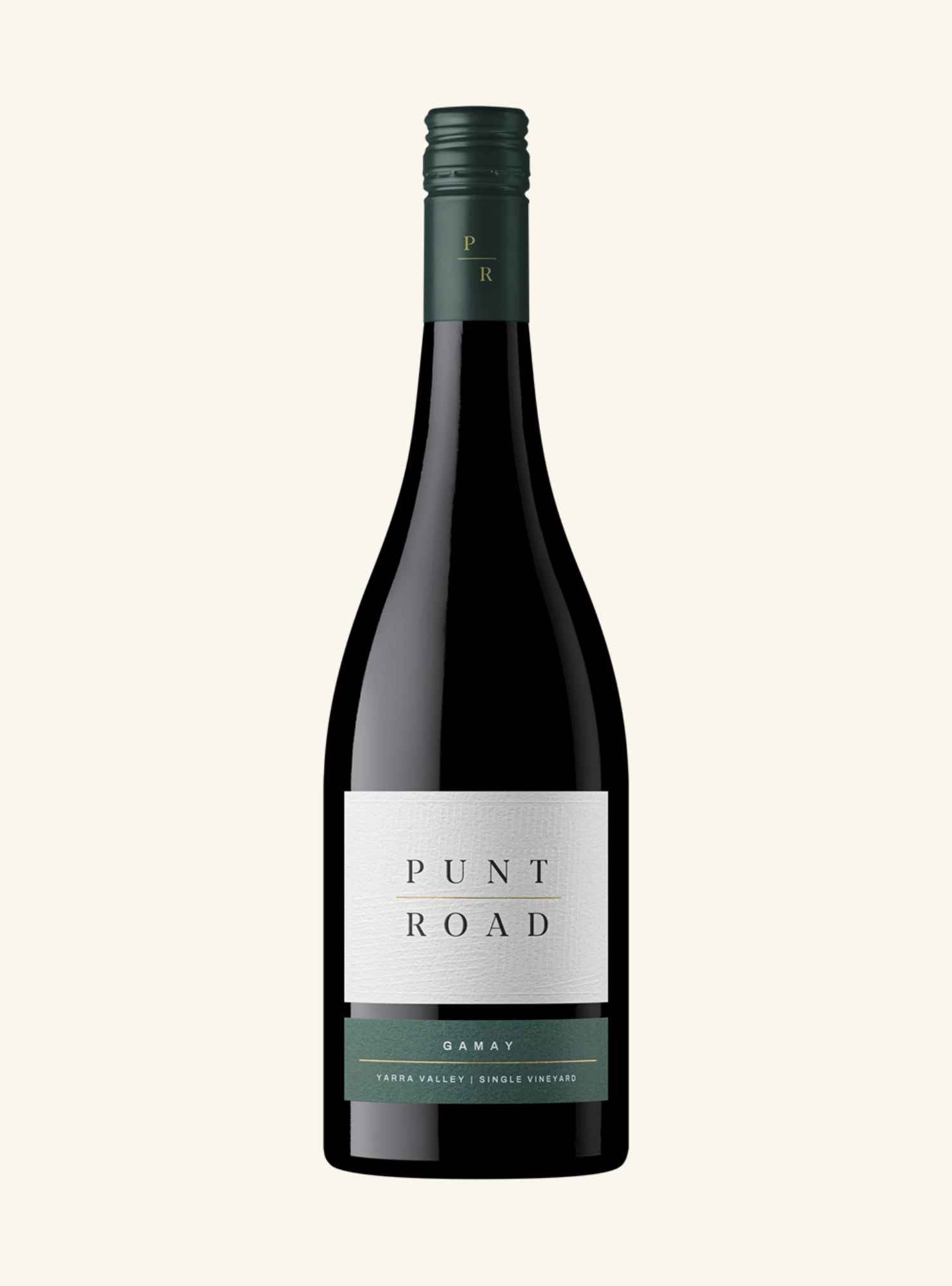 A bottle of Punt Road Gamay red wine, featuring a dark glass bottle, dark green foil and label accents, and a white label with black text, set against a solid cream background.