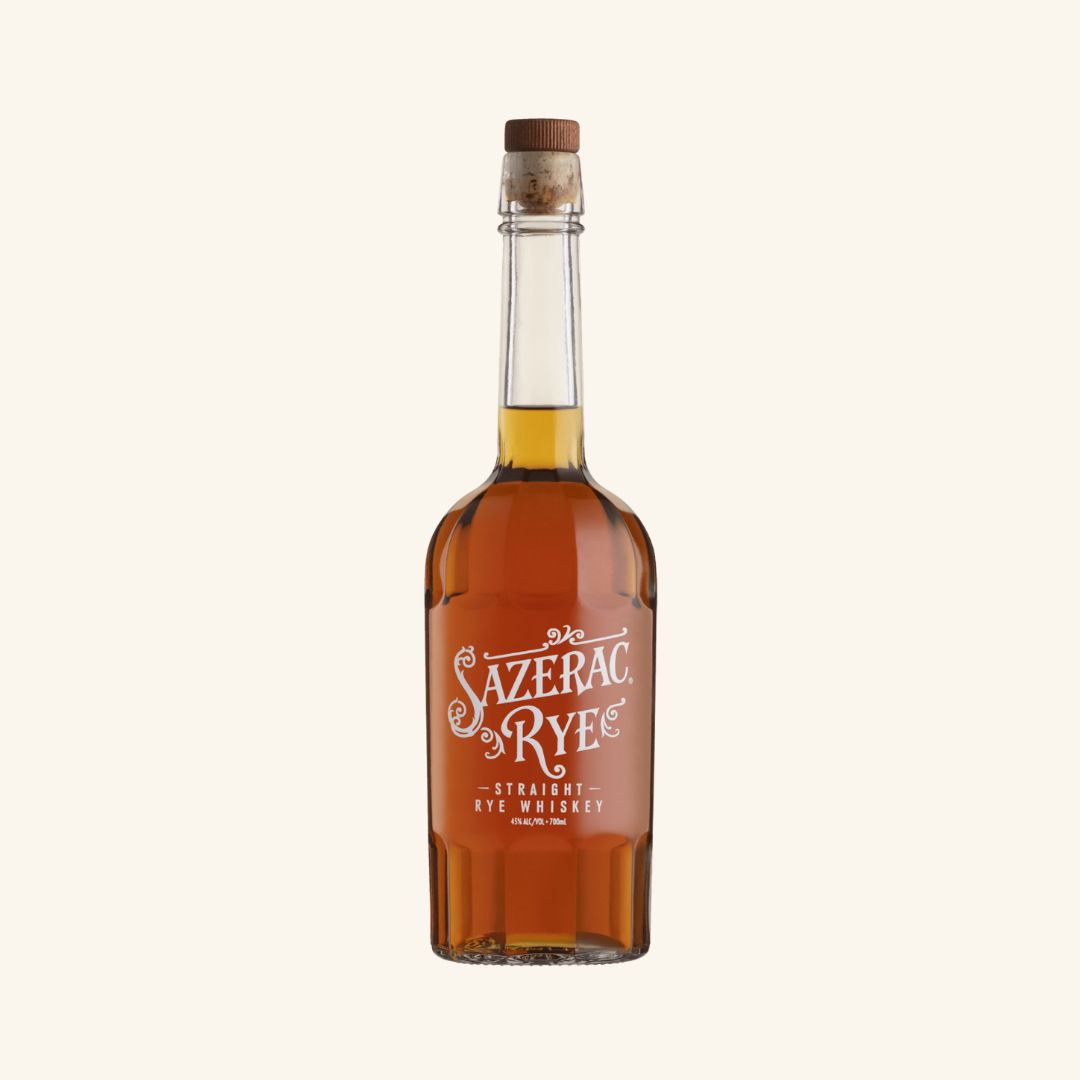 A bottle of Sazerac Rye Whiskey with a label that includes the brand name and 'Straight Rye Whiskey' text, capped with a wooden lid.