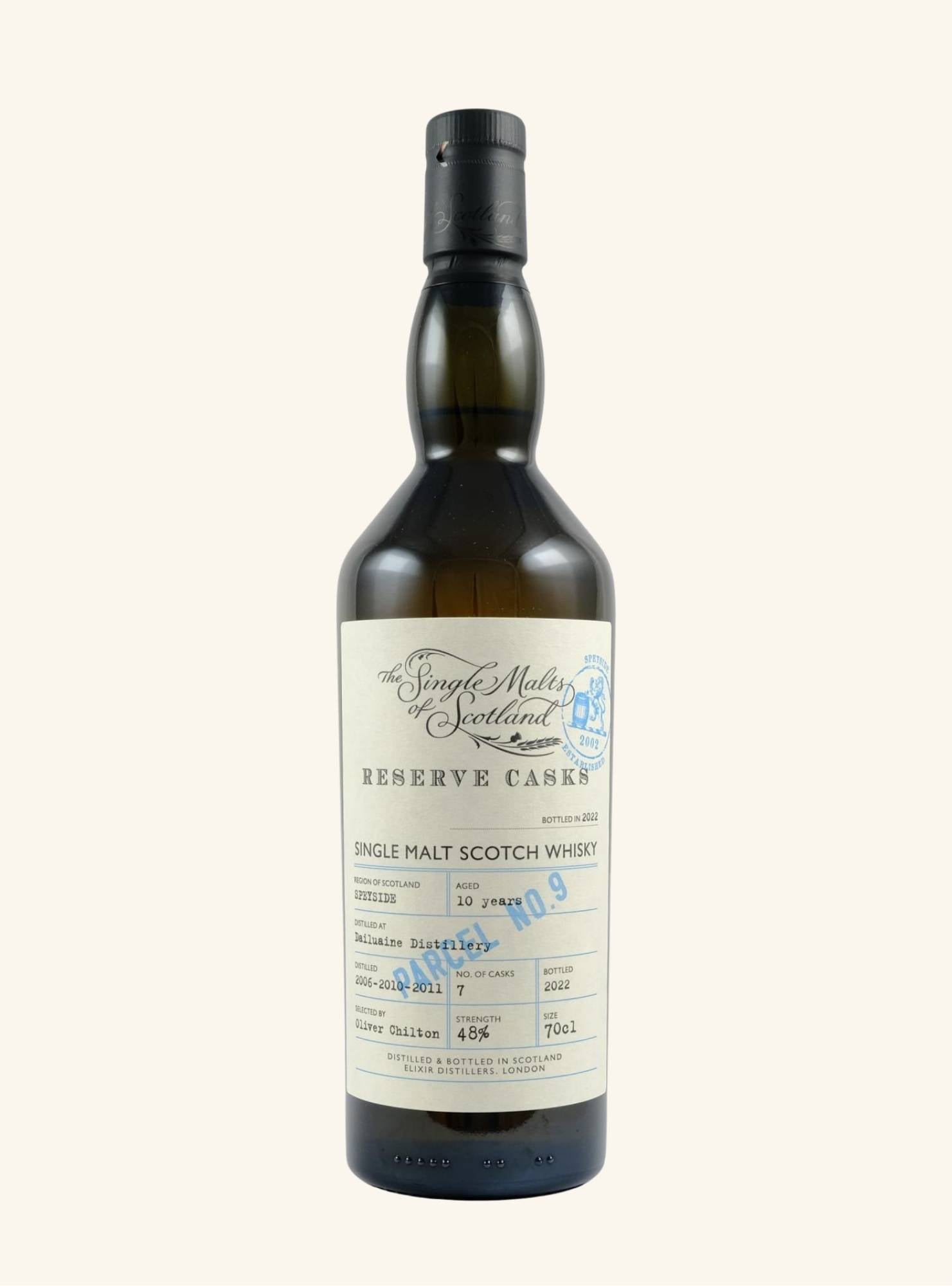 bottle of single malts of scotland dailuaine 10 year old with a white label and details of the whisky printed across it with a blue stamp 'Parcel No 9'.