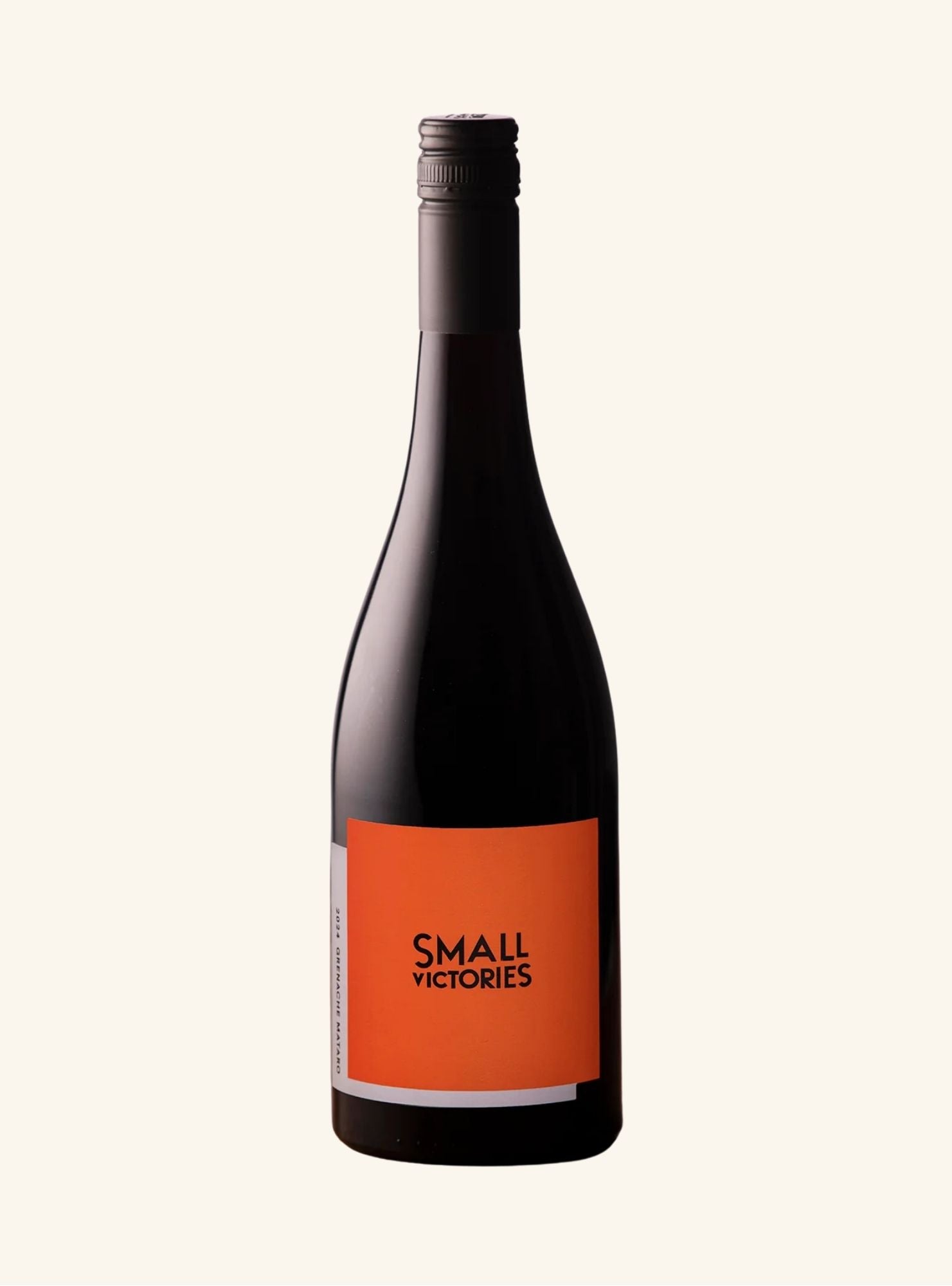Wine bottle with an orange label branded Small victoires on a white background