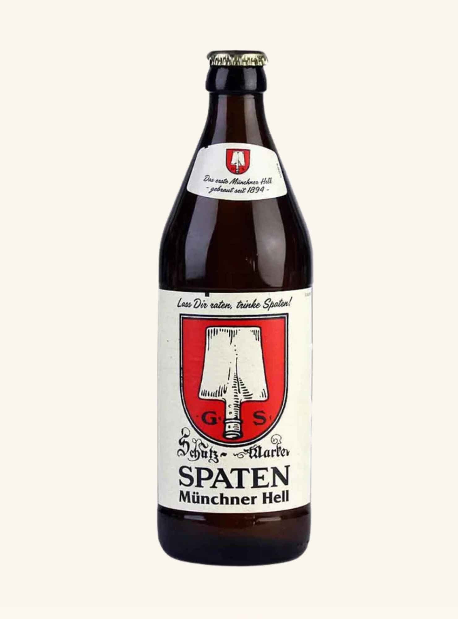 A dark brown glass bottle of Spaten Münchner Hell beer with a cream-colored label featuring a red and white coat of arms, set against a solid off-white background.