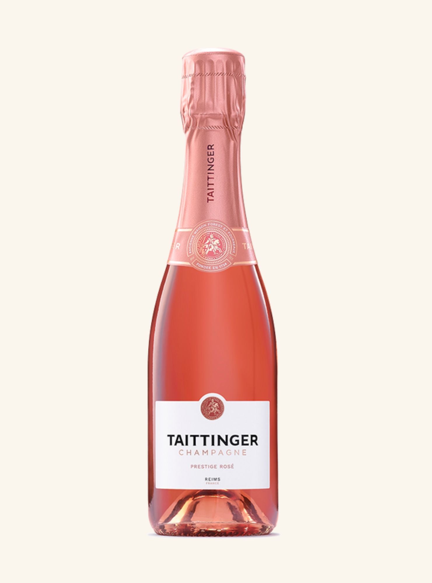Pink bottle of Taittinger champagne on a white background